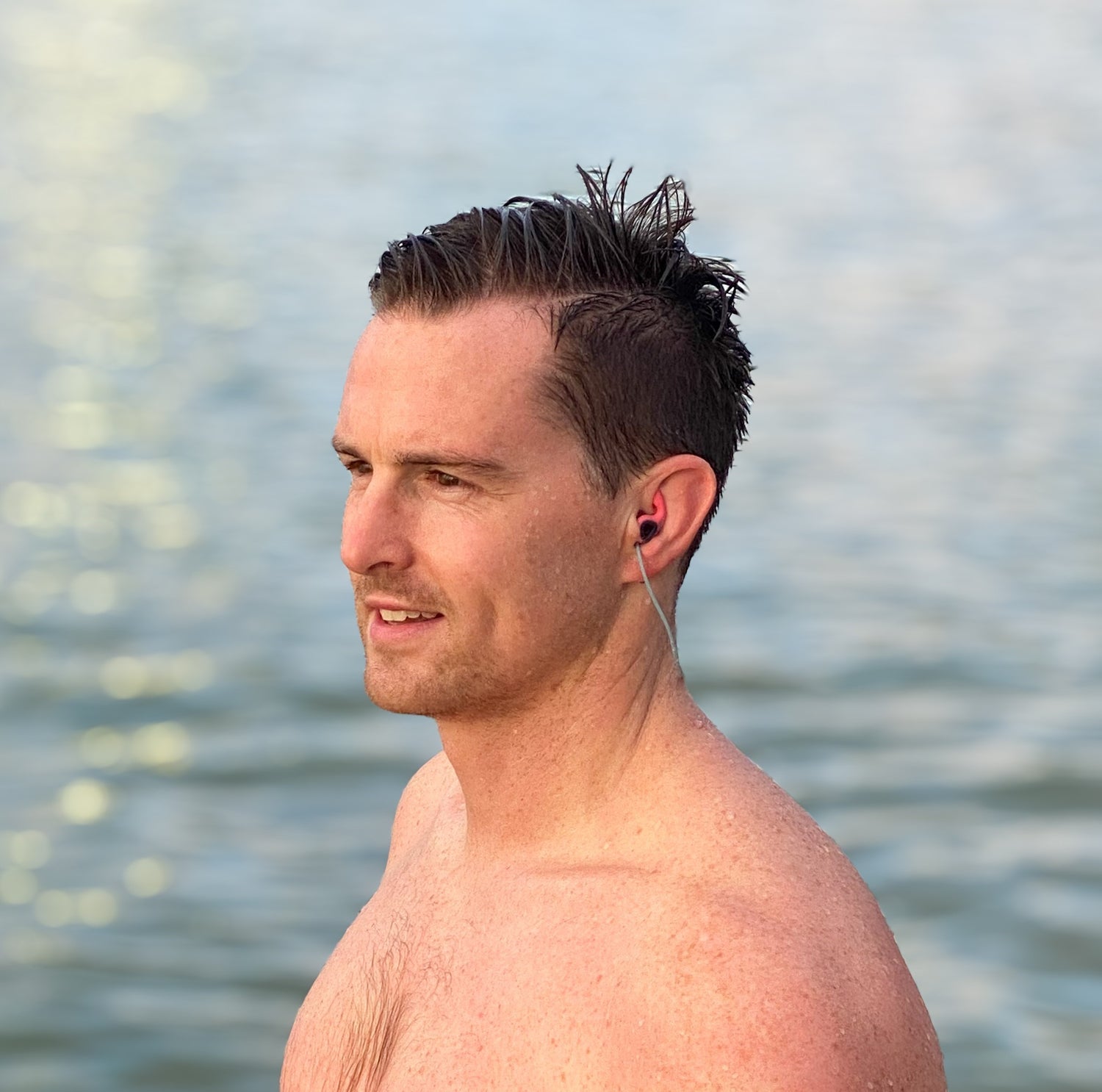 Jone Riddler wearing SurfEars watersport earplugs for swimming