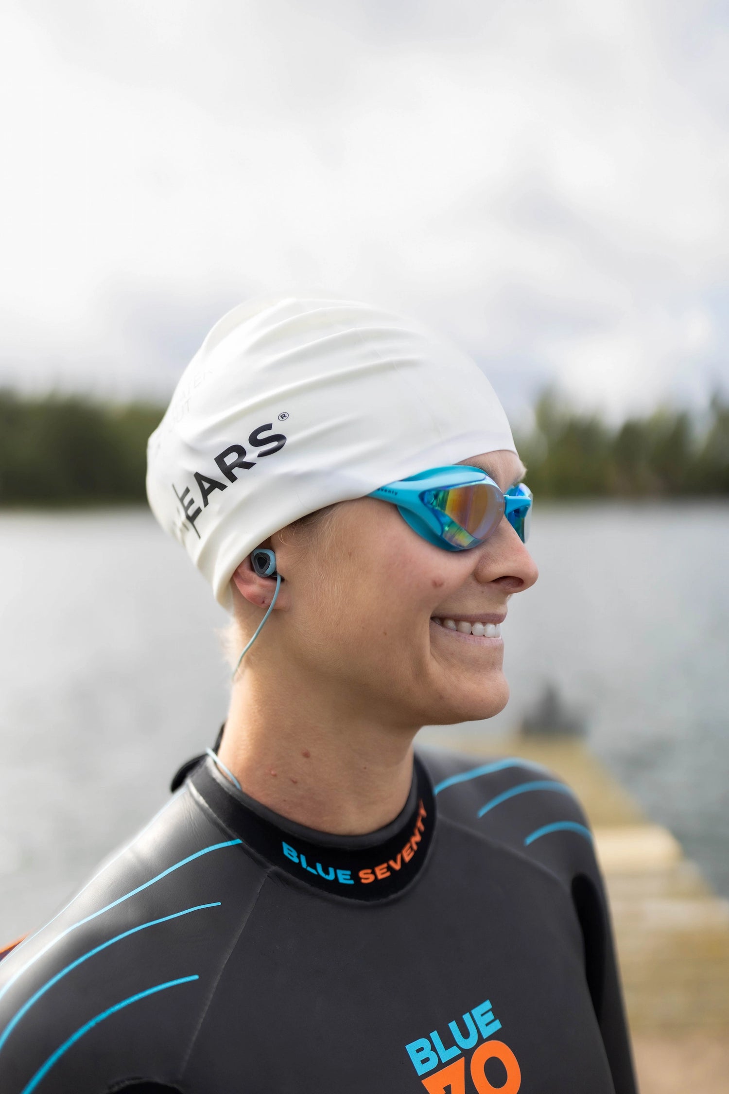 Swimmer wearing SurfEars watersport earplugs